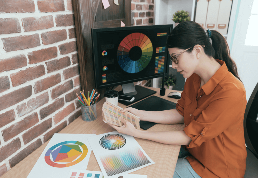 Woman viewing color wheels | Importance of Color in Marketing and Branding